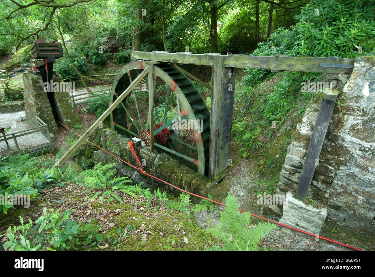 Water powered wheel at mine tin mine in Cornwall UK Stock Photo
