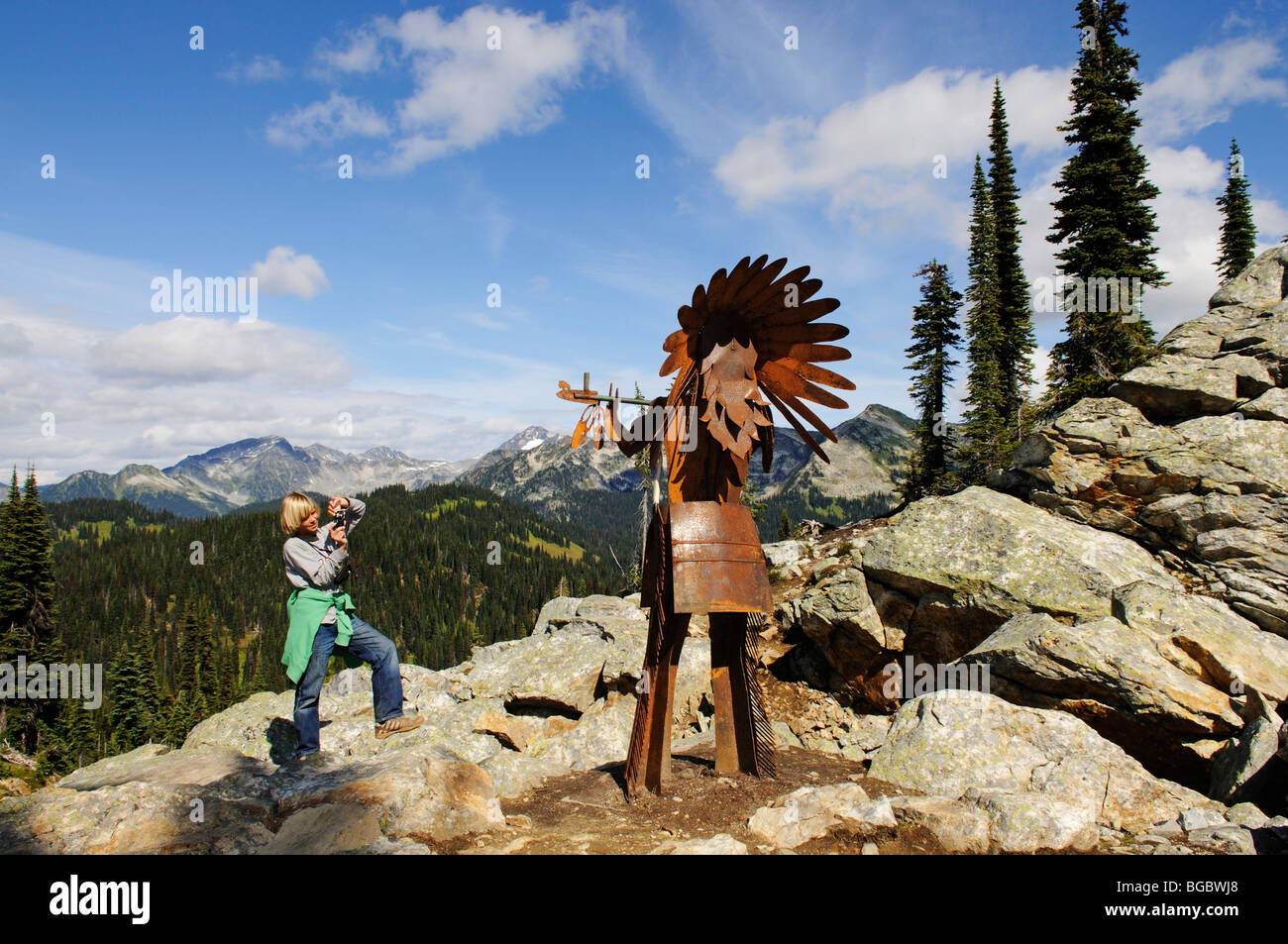 Child photographing a Native American iron chief, Mt. Revelstoke, Meadows in the Sky, Revelstoke National Park, British Columbi Stock Photo