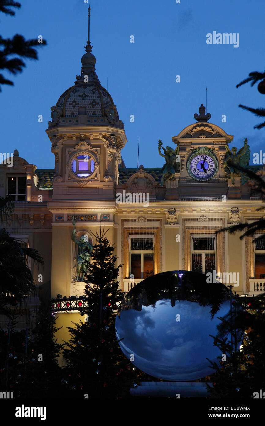 Casino and Monte Carlo Opera House with mirror and Christmas trees in the dusk, the Principality of Monaco, Europe Stock Photo