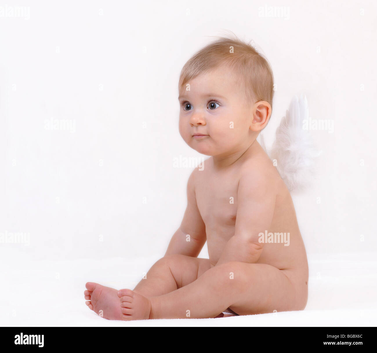 Little baby looks like angel on the white background Stock Photo