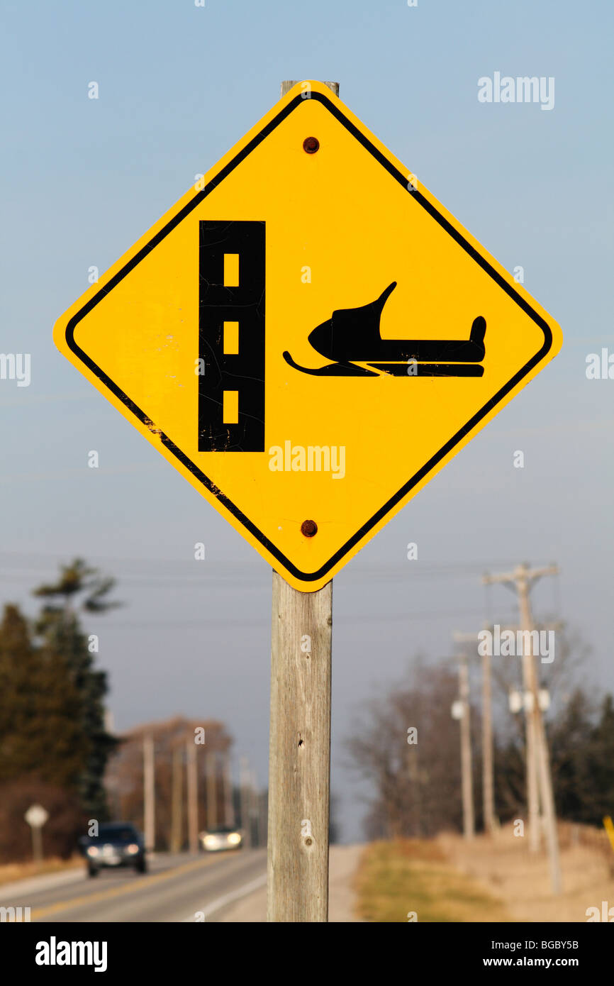 Snowmobiles Crossing Highway Traffic Sign Stock Photo