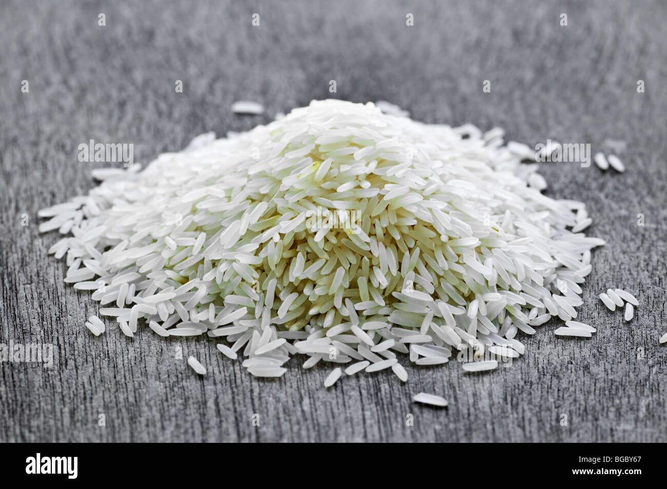 Pile of raw long grain white rice grains Stock Photo