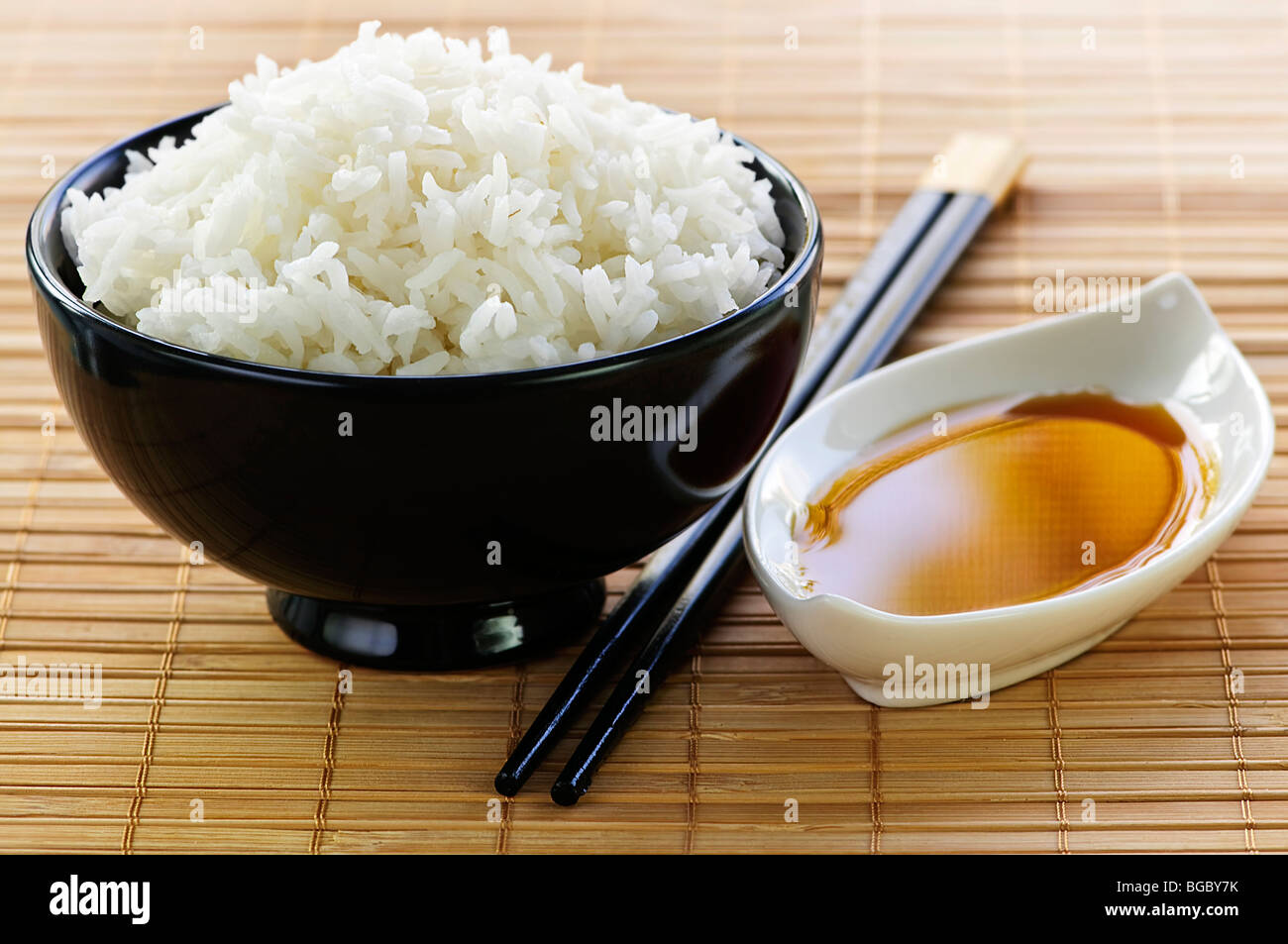 Rice bowl with soy sauce with chopsticks Stock Photo Alamy