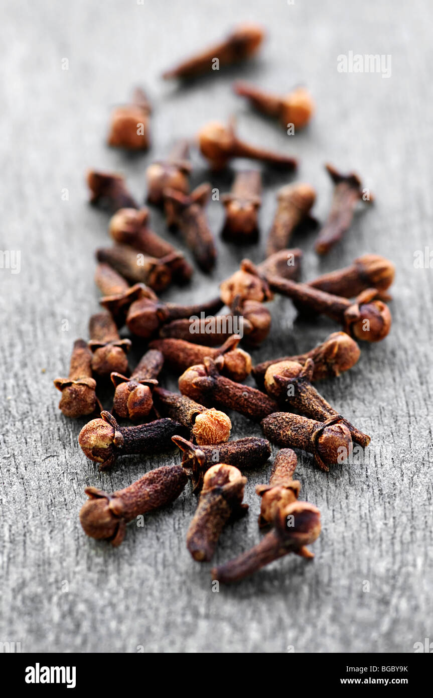 Several dried clove buds on wooden background Stock Photo Alamy