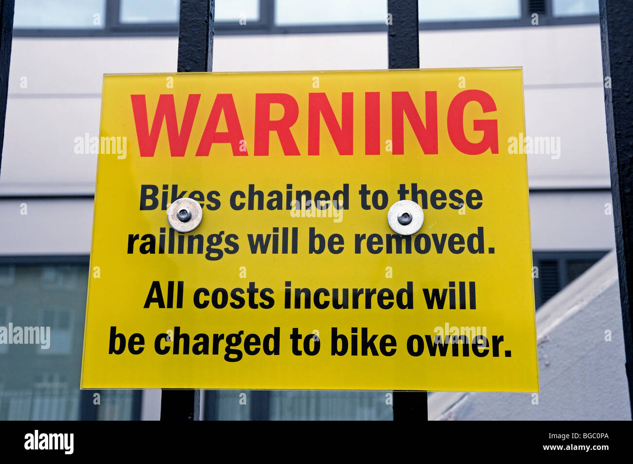 Warning Notice - Bikes chained to these railings will be removed Stock Photo