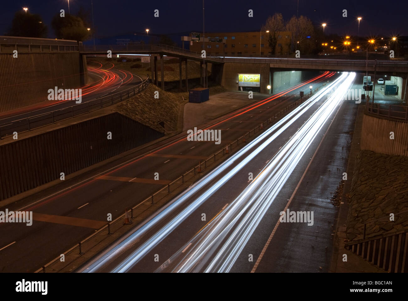 Car headlights at night exiting the Mersey Tunnel Liverpool UK Stock Photo