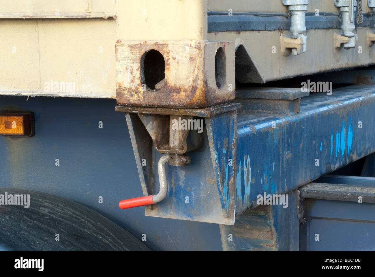 Shipping container Twistlock connection on HGV in locked position with container attached Stock Photo