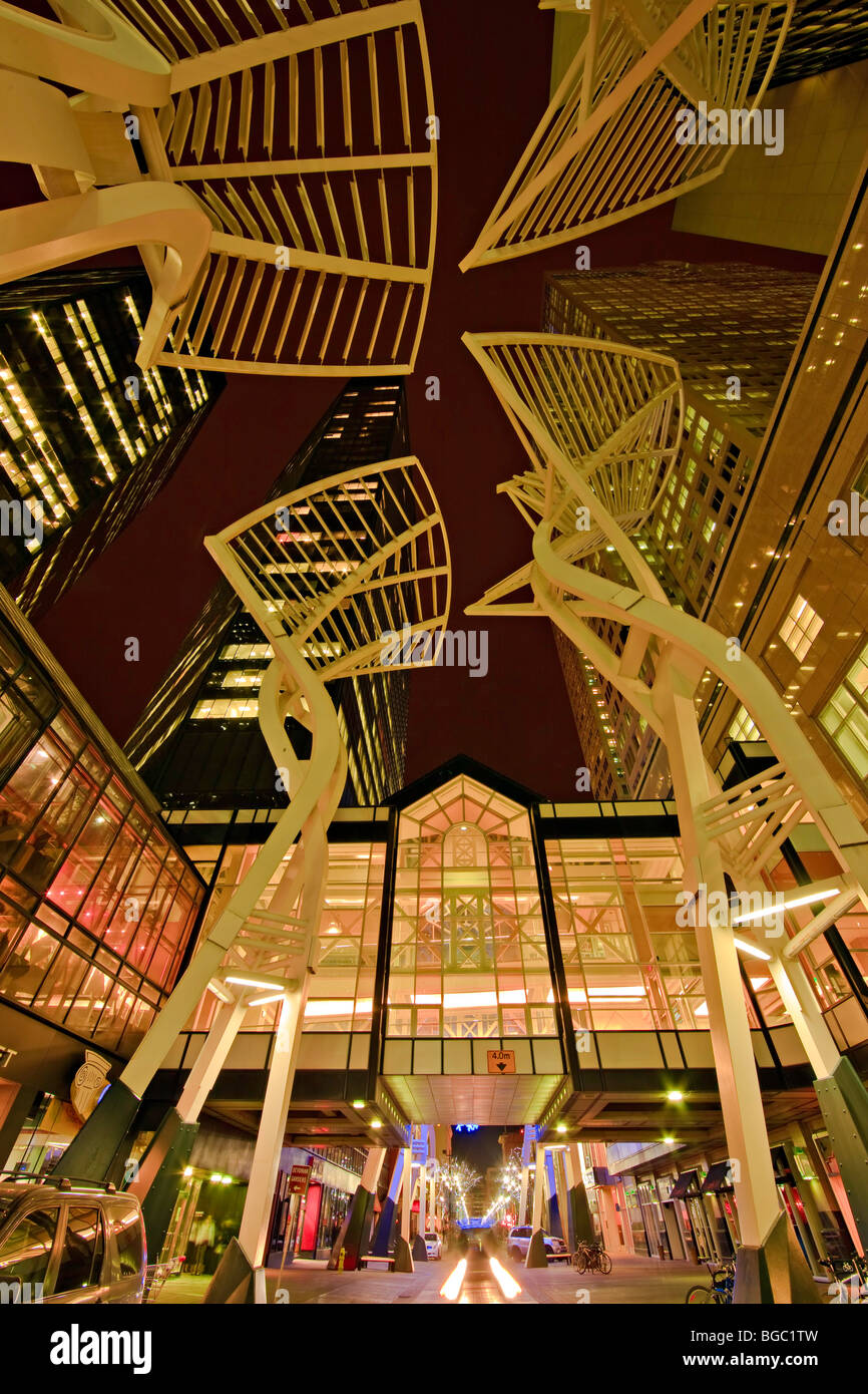The steel "Trees" sculpture at night along Stephen Avenue Mall (aka Stephen Avenue Walk and Steven Avenue), 8th Avenue SW, City  Stock Photo