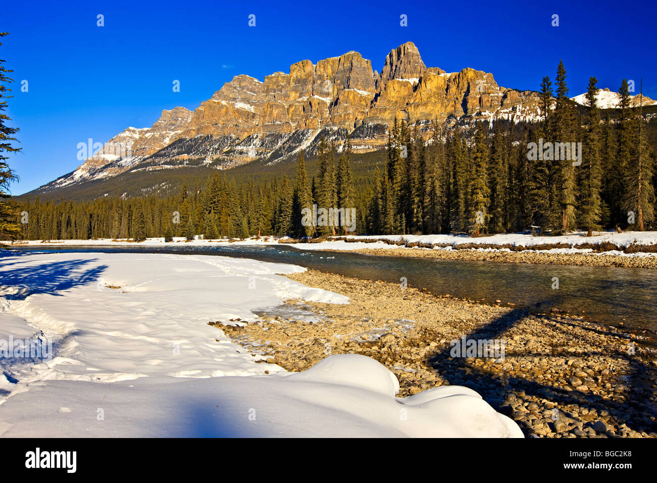Castle Mountain (2862 metres/9390 feet), and the Bow River during late winter, Highway 93, Banff National Park, Canadian Rocky M Stock Photo