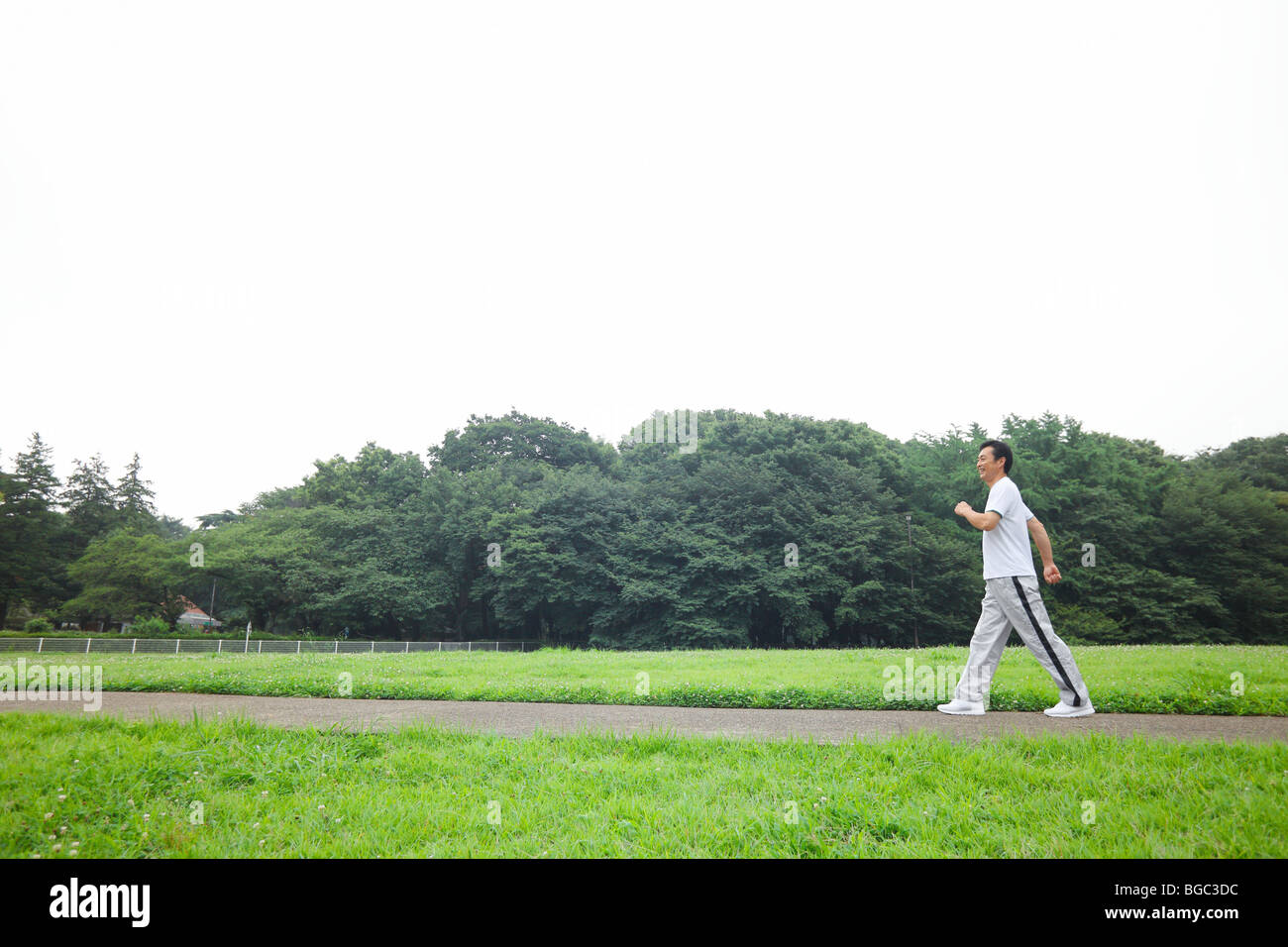 Black man walking side view hi-res stock photography and images - Alamy
