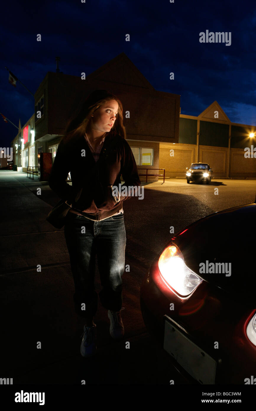 Girl in dark parking lot Stock Photo Alamy