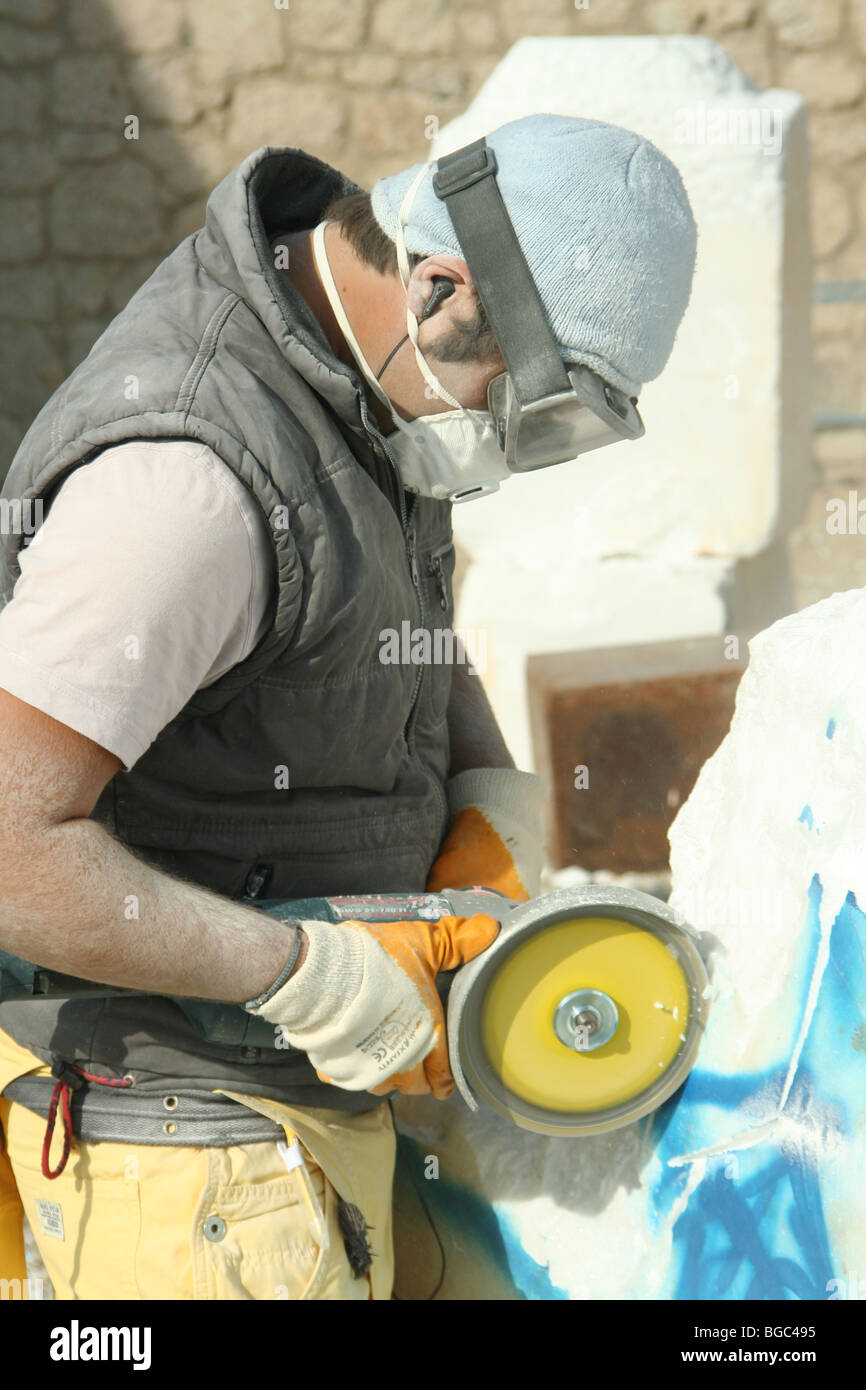 young sculptor working with marble Stock Photo Alamy