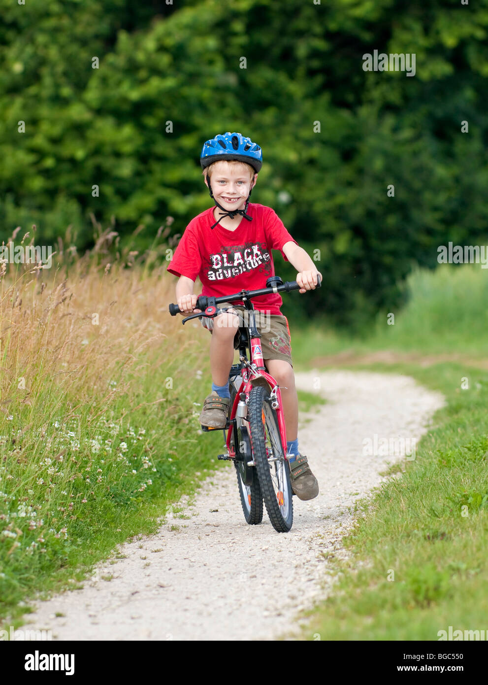 Seven year old boy riding bike hi-res stock photography and images - Alamy