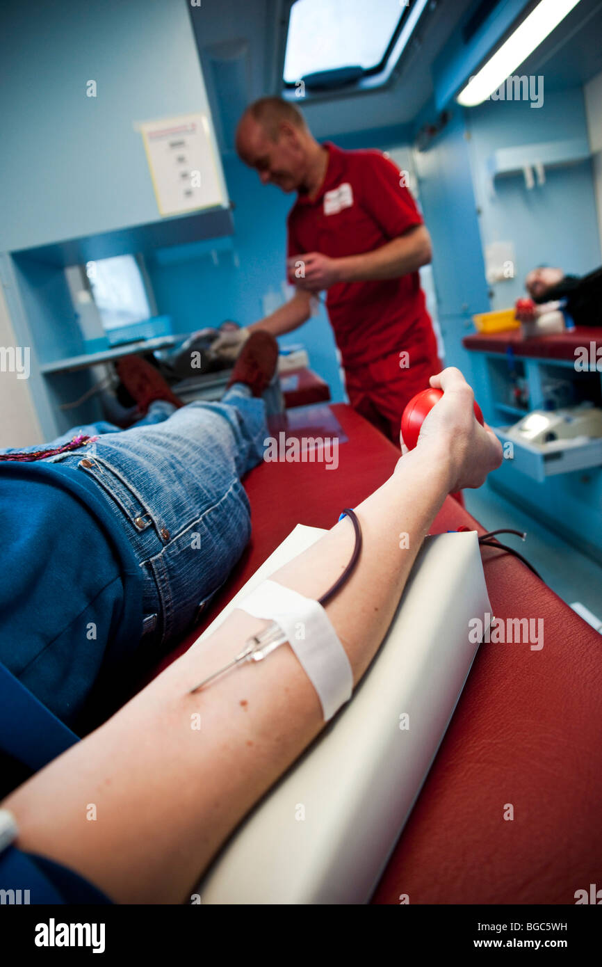 Blood donation in a Red Cross blood donation car Stock Photo