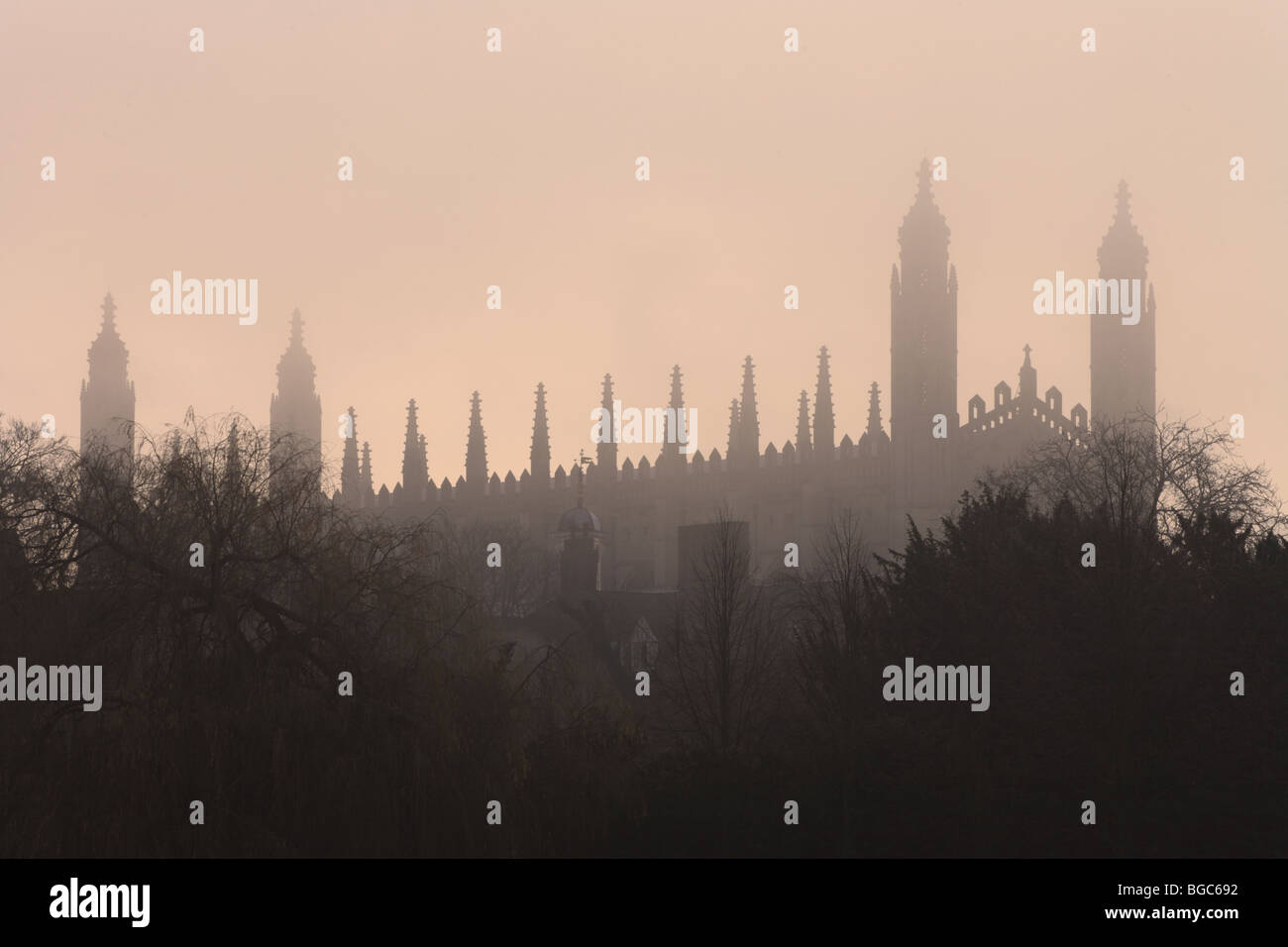 Kings College Chapel in the morning mist as the sun rises over Cambridge. Stock Photo