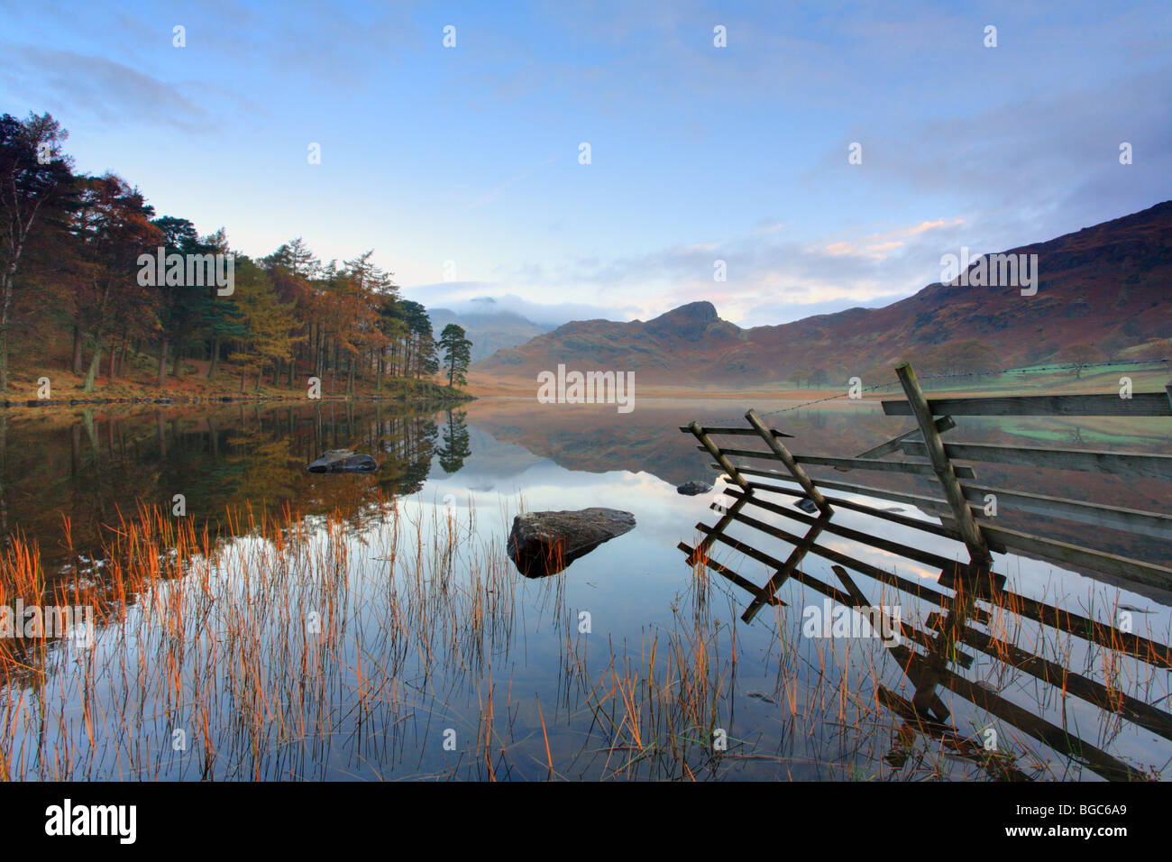 'Blea Tarn' reflections first light on an autumn morning. English Lakes District, UK Stock Photo
