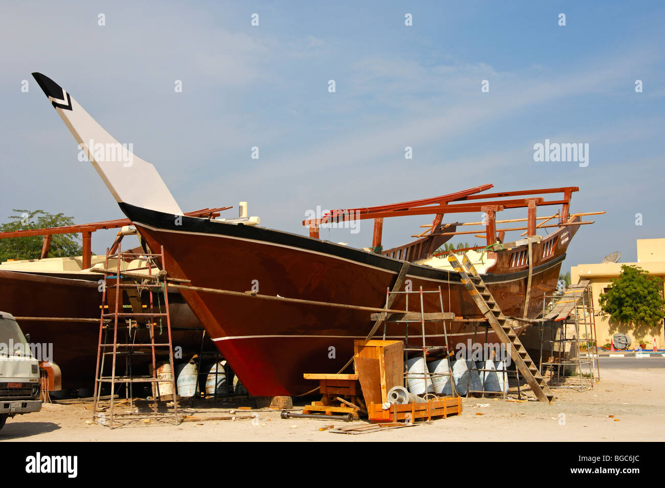 Glass fiber dhow at a shipyard for dhows in modern plastic construction in Ajman, Ajman Emirate, United Arab Emirates, Middle E Stock Photo