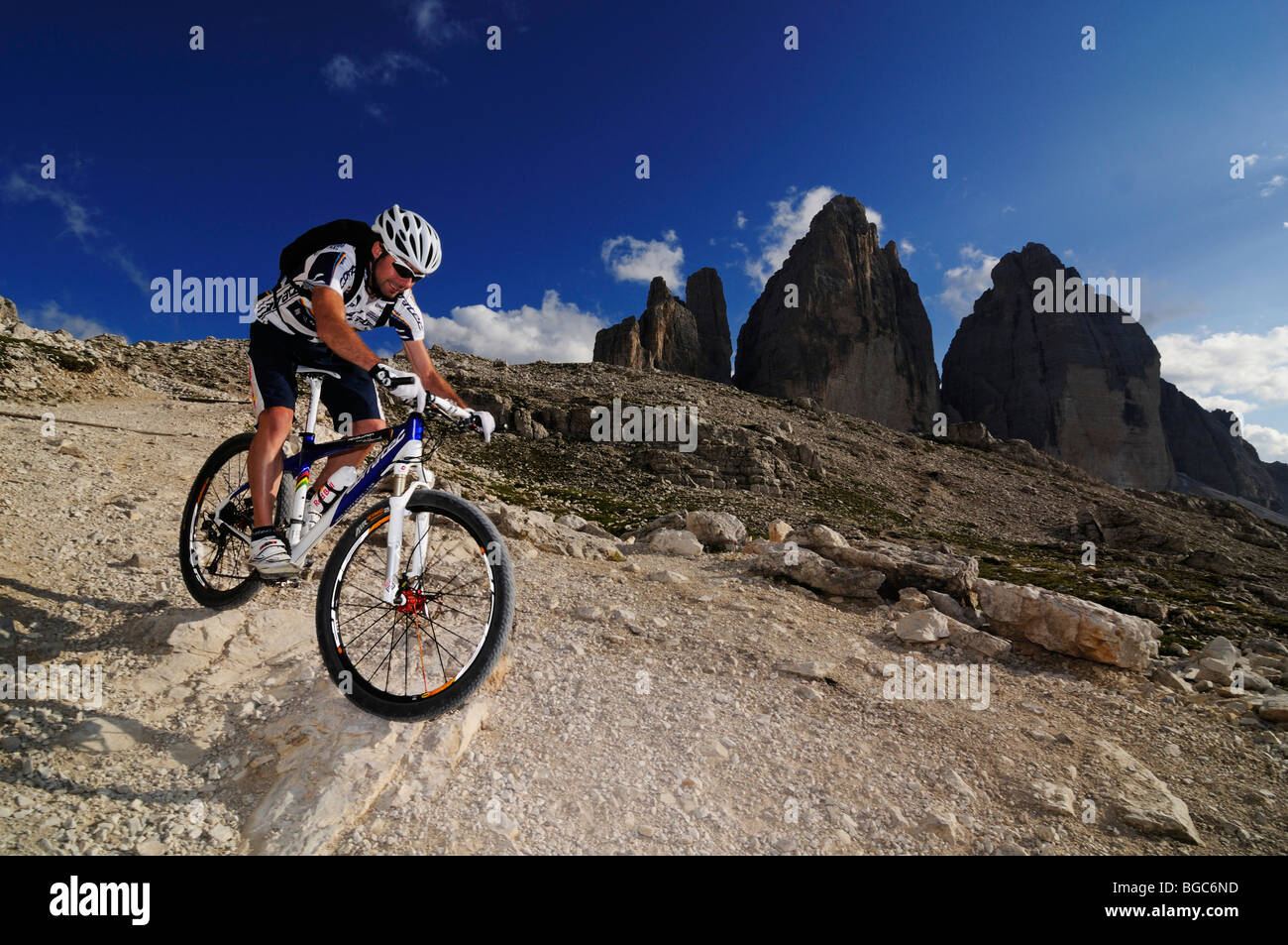 Mountain bike pro Roland Stauder in front of the Tre Cime di Lavaredo, Three Peaks, Alta Pusteria, Dolomites, South Tyrol, Ital Stock Photo