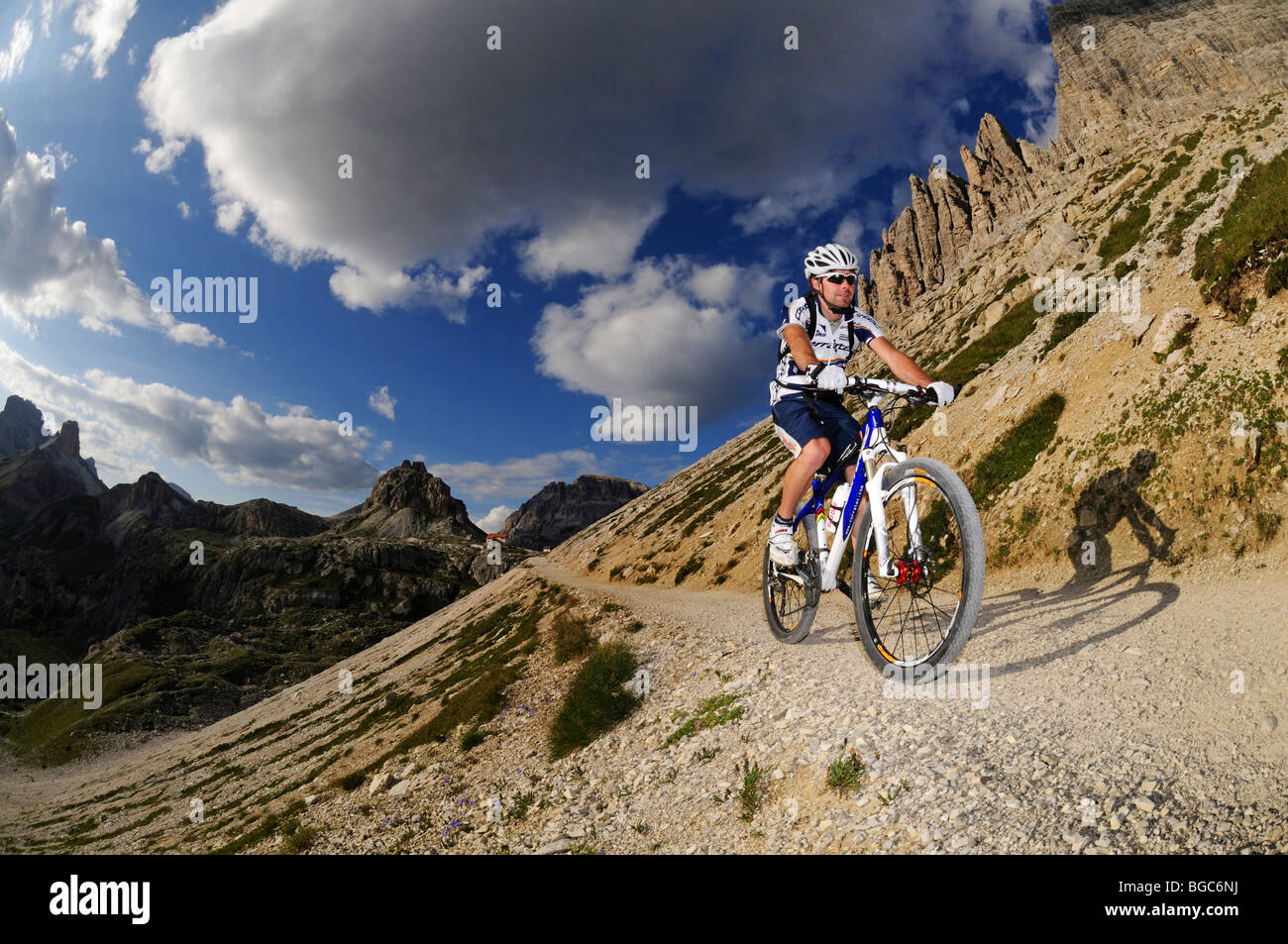 Mountain bike pro Roland Stauder in front of Patern Pass, Alta Pusteria, Dolomites, South Tyrol, Italy, Europe Stock Photo