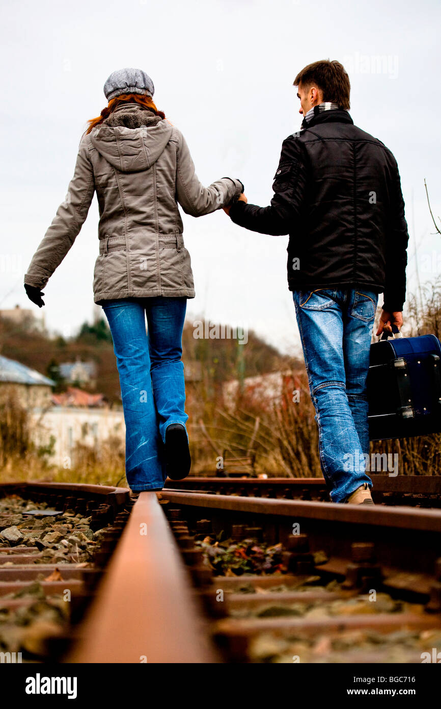 Couple on rail track Stock Photo