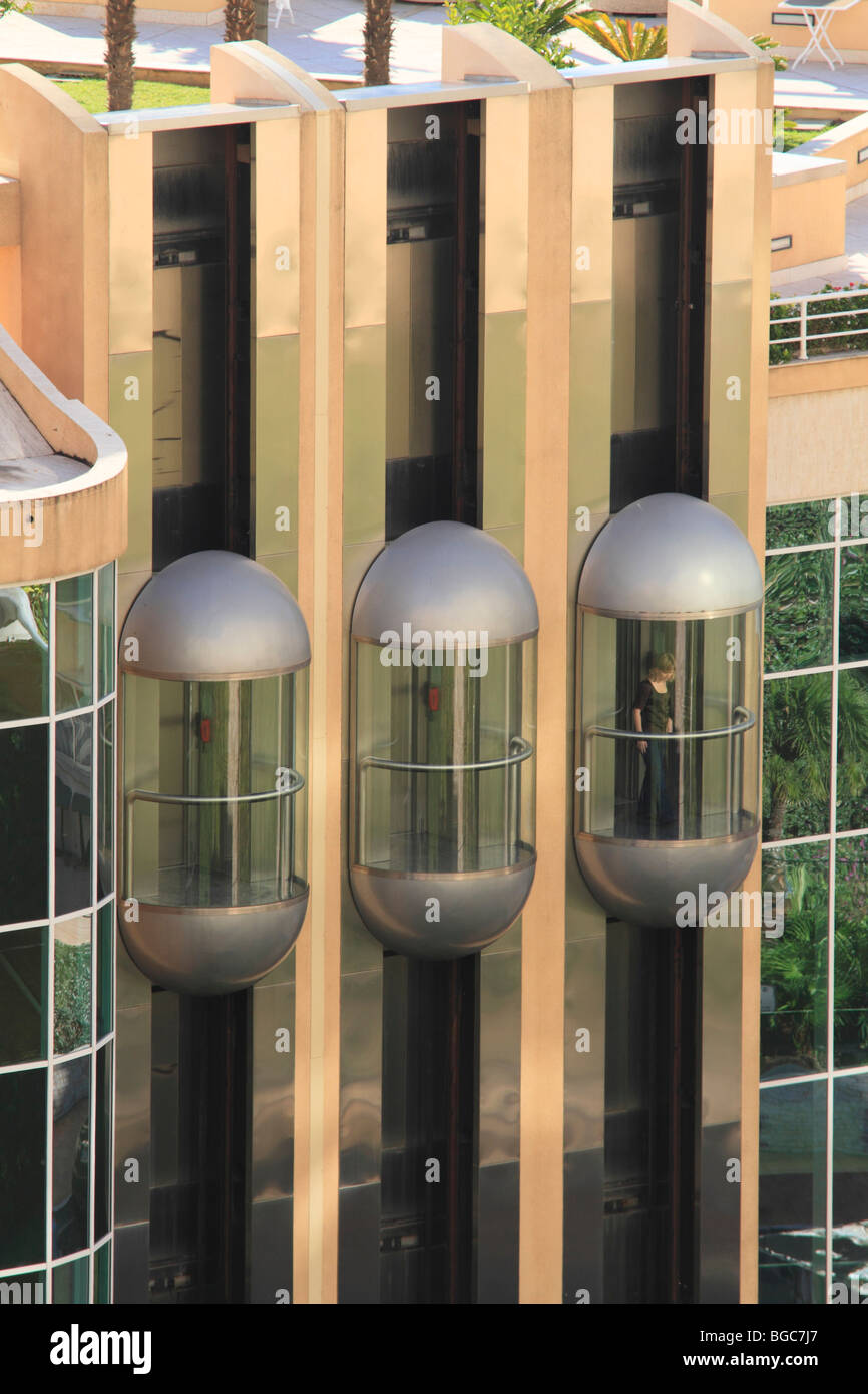 Three glass elevators on the facade of the Hotel Le Méridien Beach Plaza, Le Larvotto, Monaco, Cote d'Azur, Europe Stock Photo