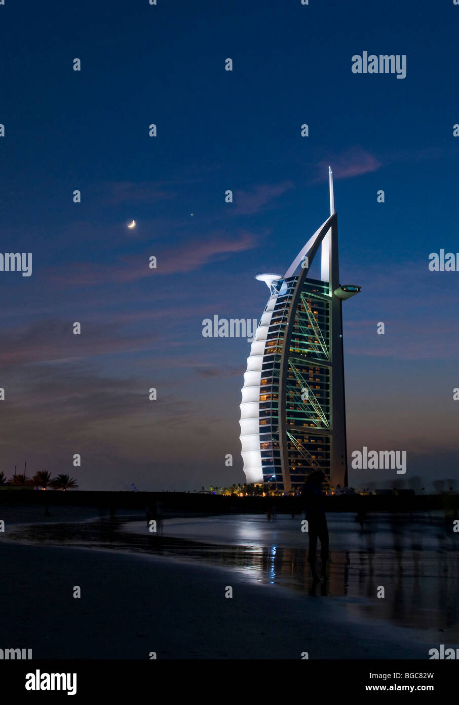 Burj al Arab hotel at night with moon, Dubai, United Arab Emirates, Middle East Stock Photo