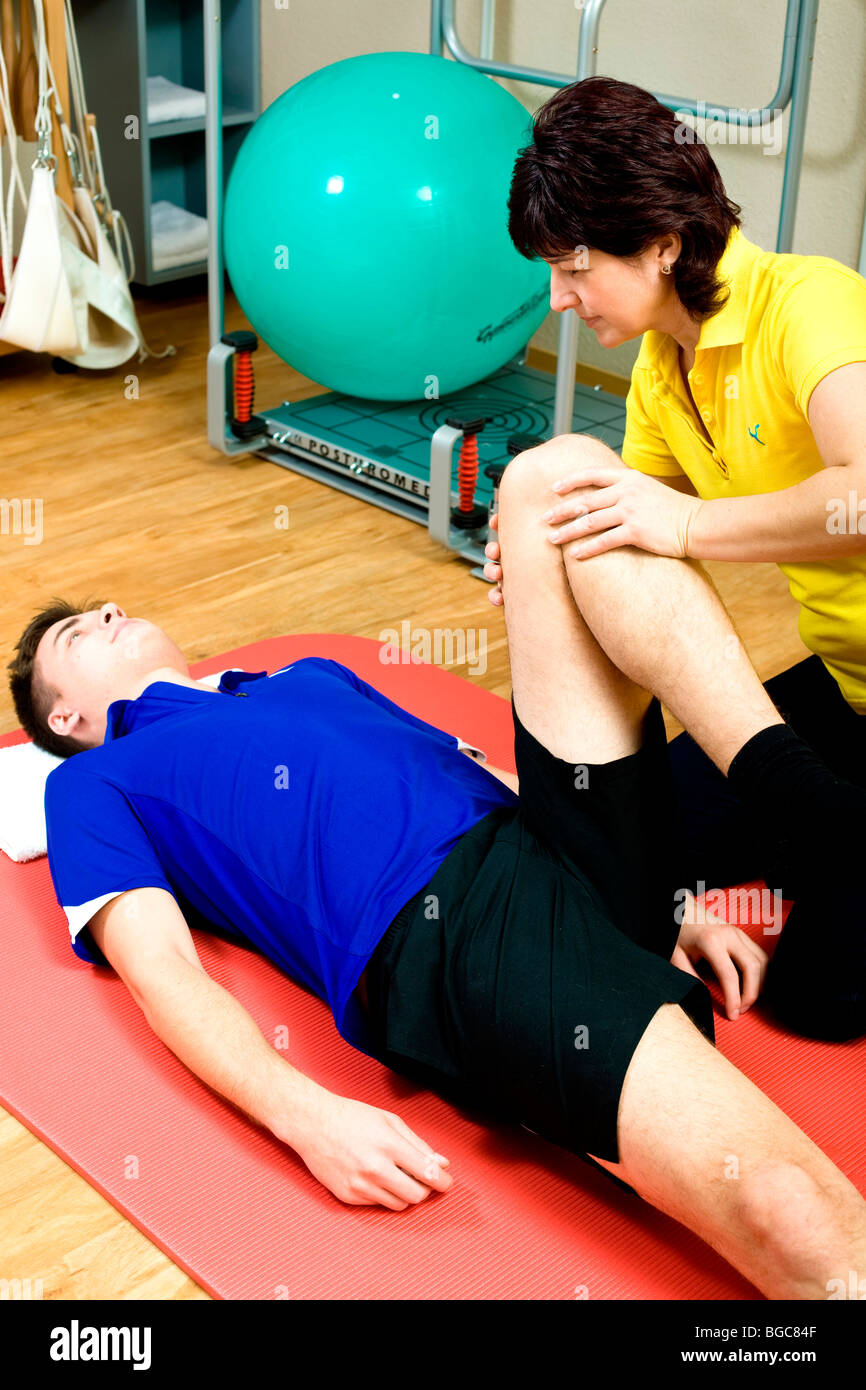 Physiotherapist and patient doing physiotherapy Stock Photo