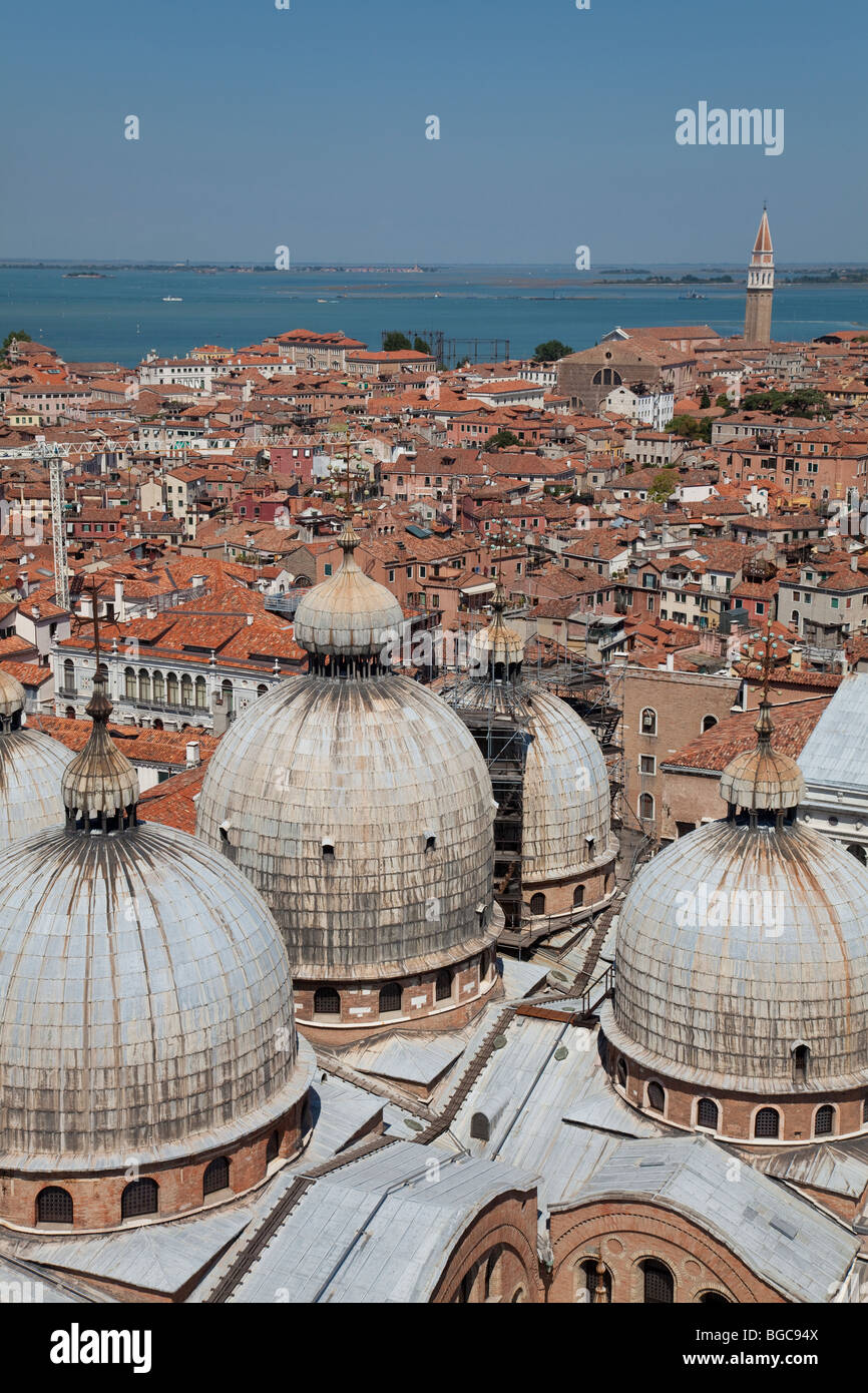 A view of Venice, Italy from the top of the Campanile. Overlooking buildings and looking onto the Lagoon Islands. Stock Photo