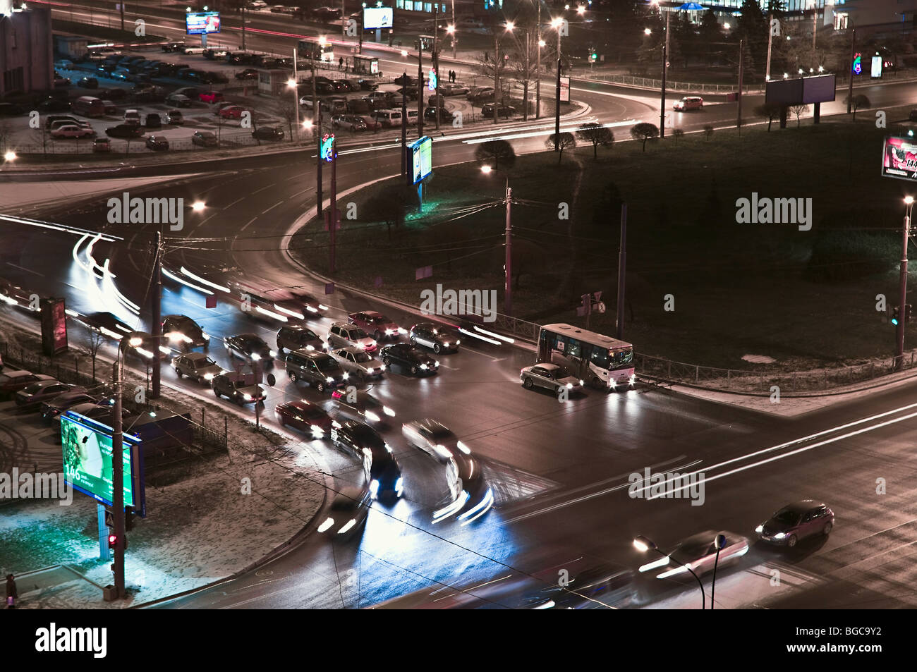 Night scene: crossroad in St. Petersburg city, lines from headlight of ...