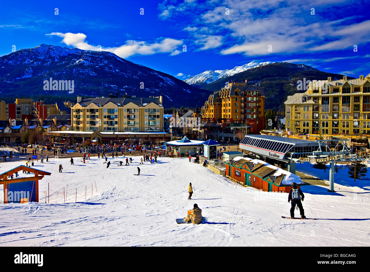 Skiers and snowboarders at the base of Whistler Mountain and the Excalibur Gondola Lift, Whistler Village, British Columbia, Can Stock Photo