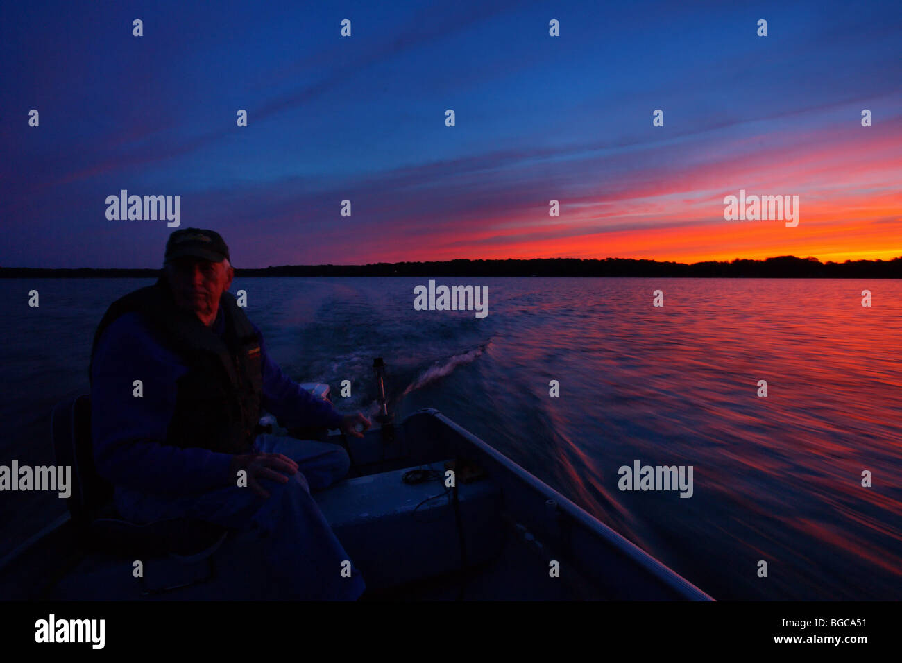 Man driving boat hat hi-res stock photography and images - Alamy