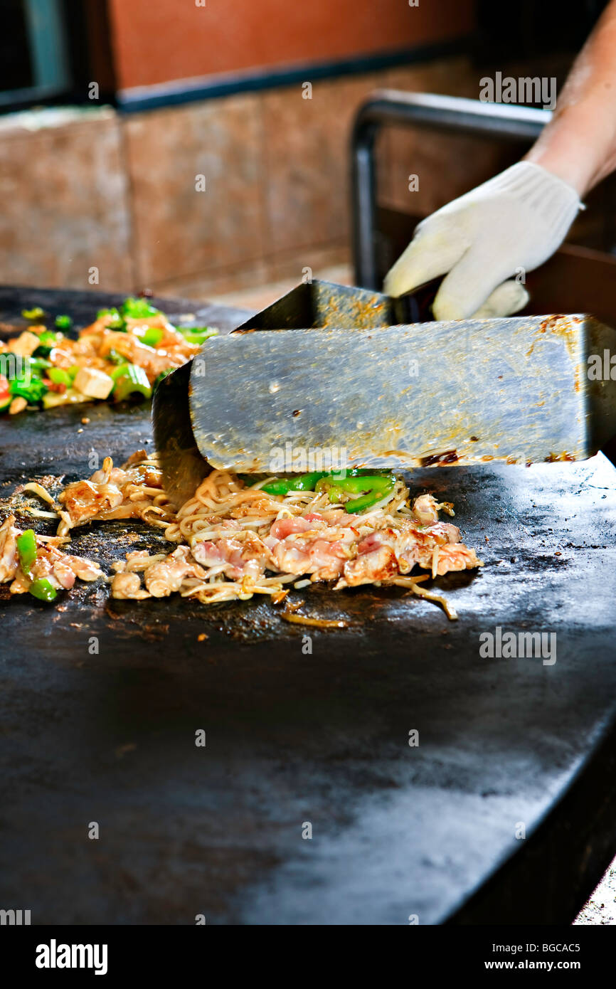 Food preparation at the Mongolie Grill World Famous Stirfry Restaurant in Whistler Village, British Columbia, Canada. Property R Stock Photo