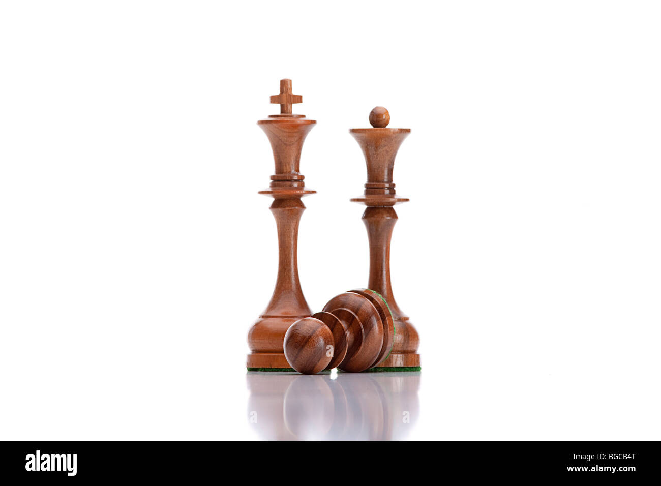 chess game - black pawn lying under black king and queen Stock Photo