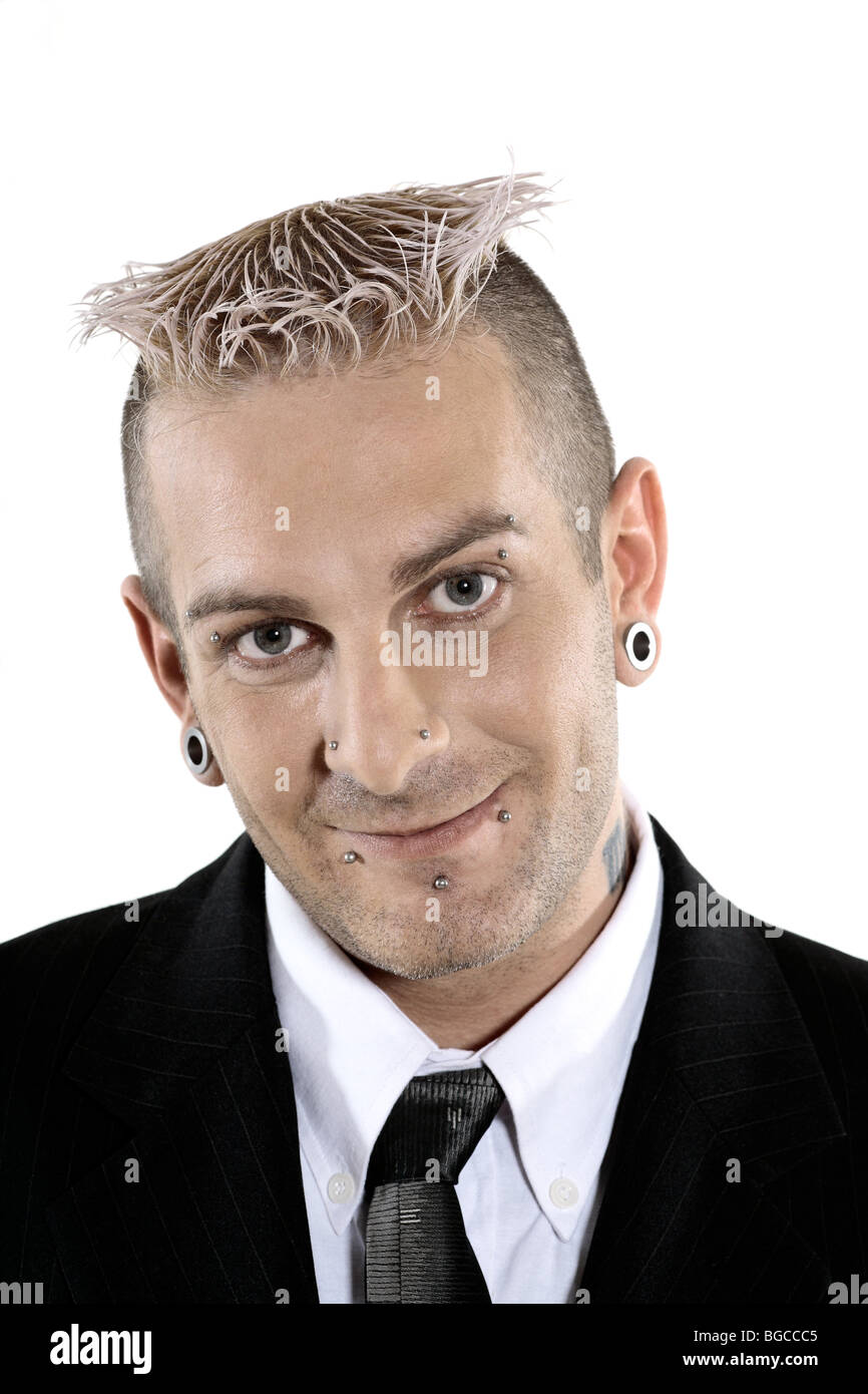 studio shot of isolated picture of a strange caucasian businessman with piercing and tattoo Stock Photo
