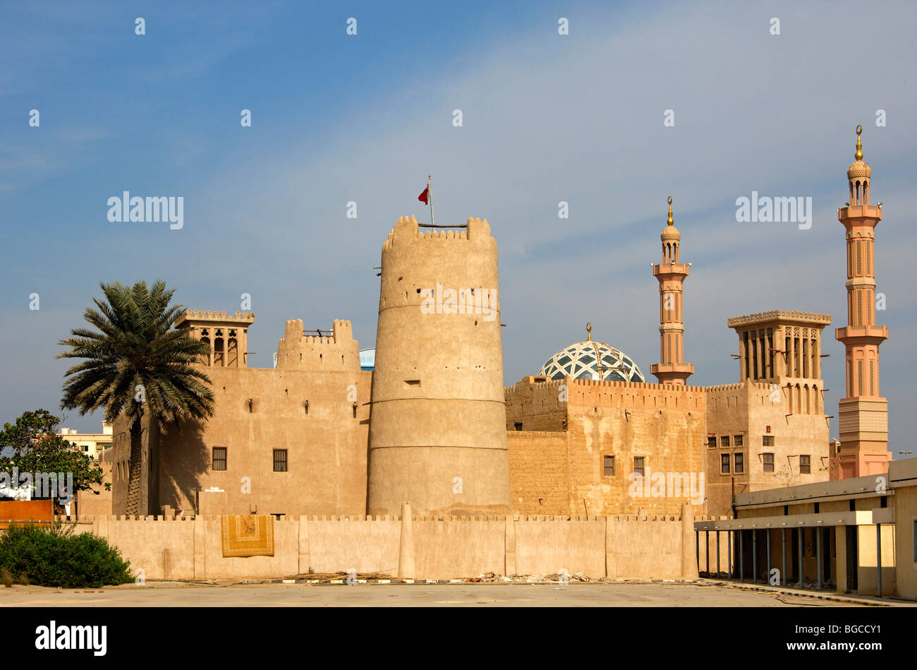 Historical centre of an Arab town with watchtower, wind tower, minarets and dome of a mosque, Ajman, United Arab Emirates Stock Photo