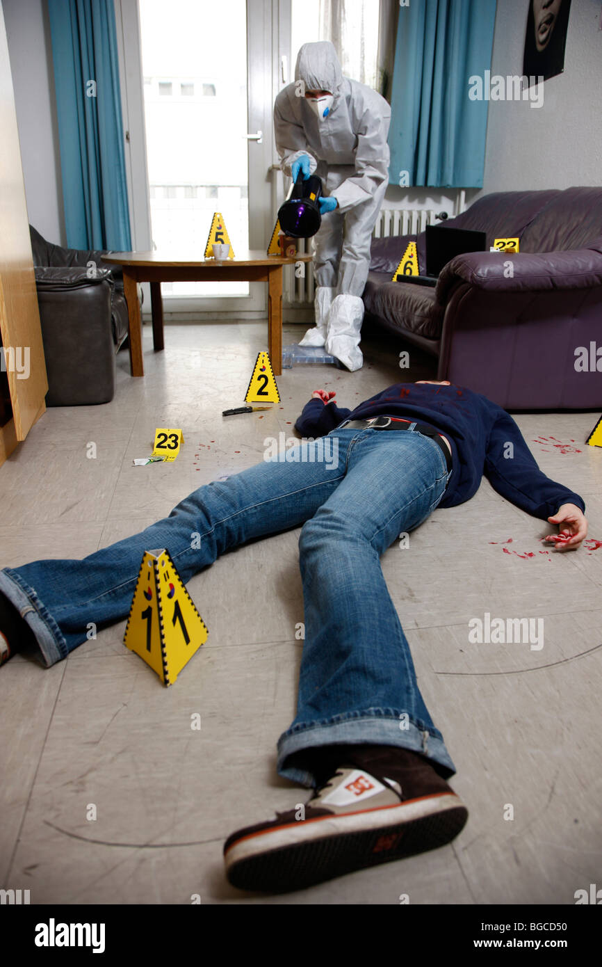 Crime scene investigation, forensic people at a murder scene. Police work, preservation of evidences. Stock Photo