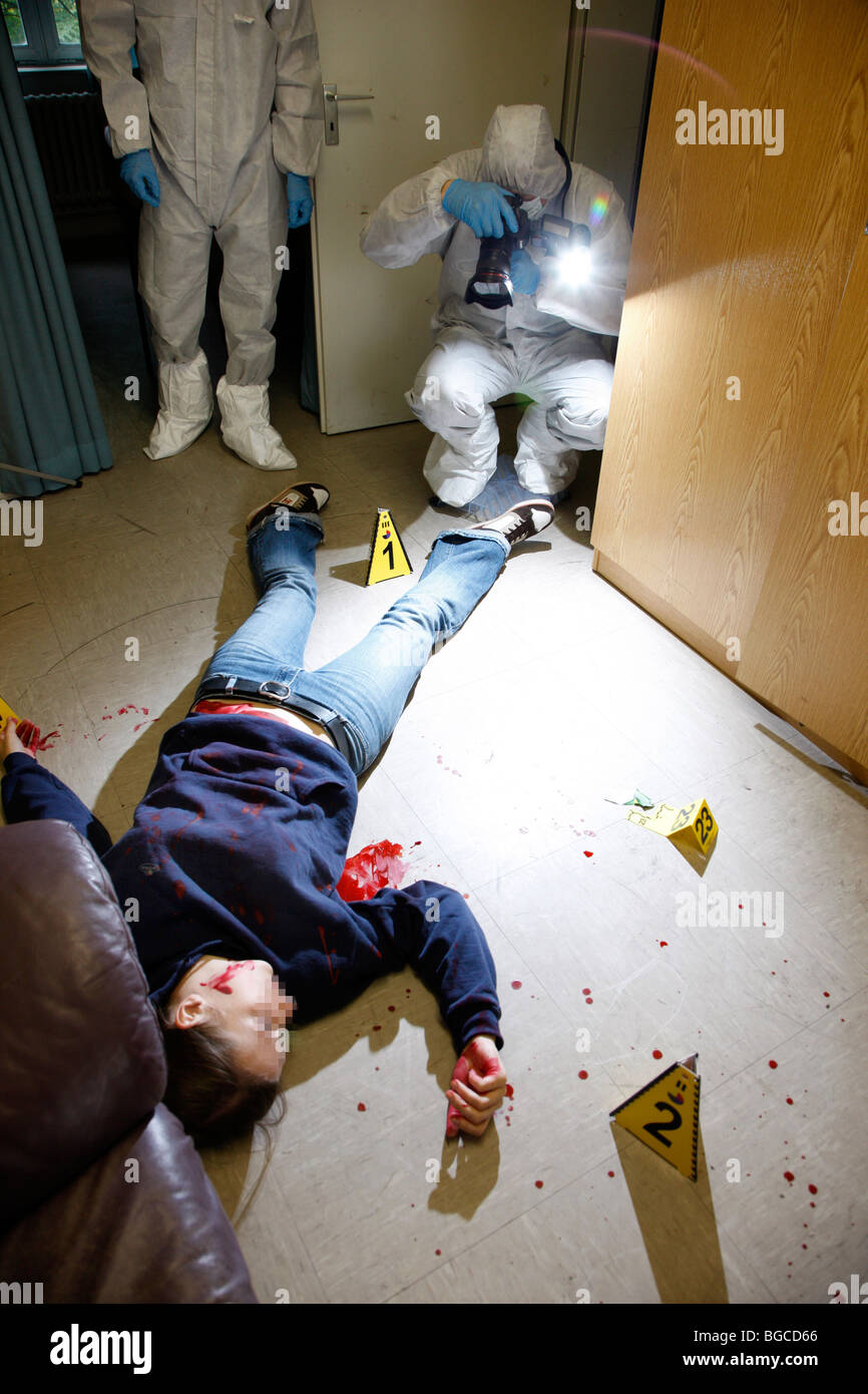 Crime scene investigation, forensic people at a murder scene. Police work, preservation of evidences. Stock Photo