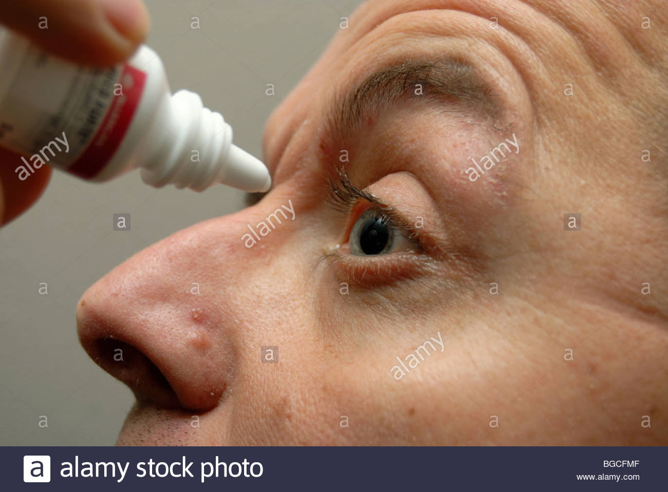 Man using Allergan Pred Forte eye drops for use for eye infections