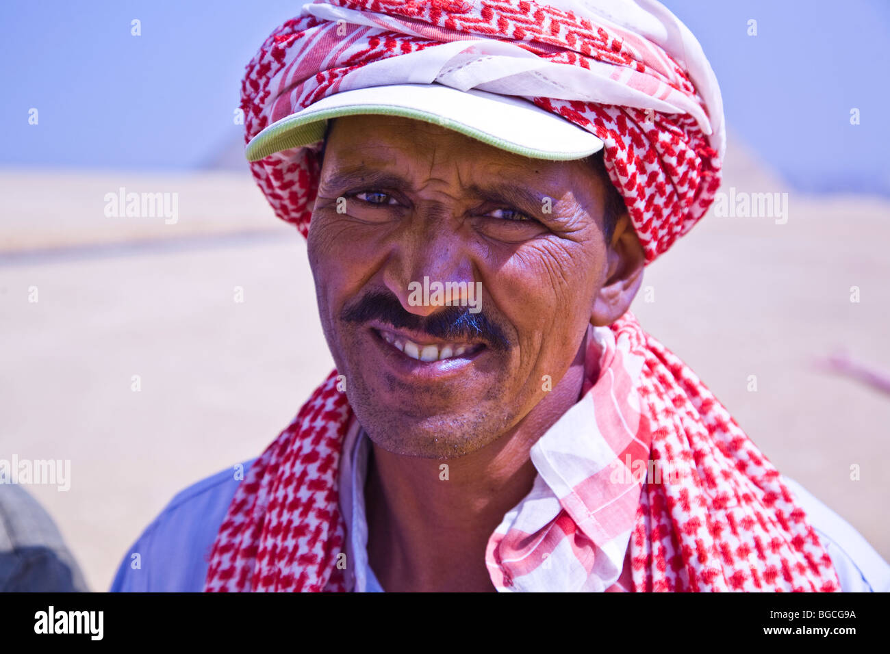 A close up of an Egyptian male camel driver who gives camel rides at the Pyramids of Giza in Egypt Stock Photo