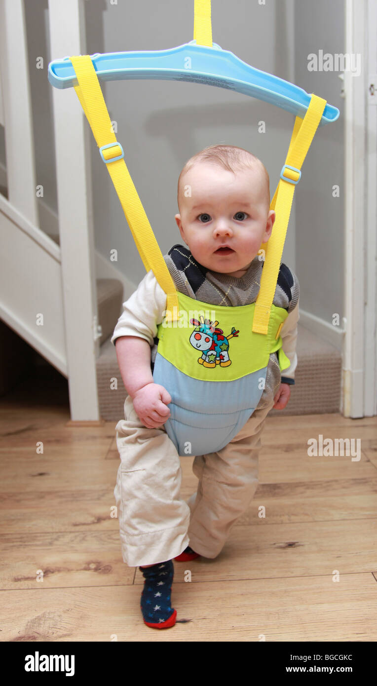 Baby boy in a baby bouncer Stock Photo Alamy
