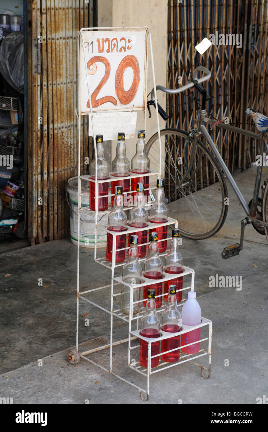 Thailand; Kanchanaburi; Bottles of Gasoline for sale Stock Photo