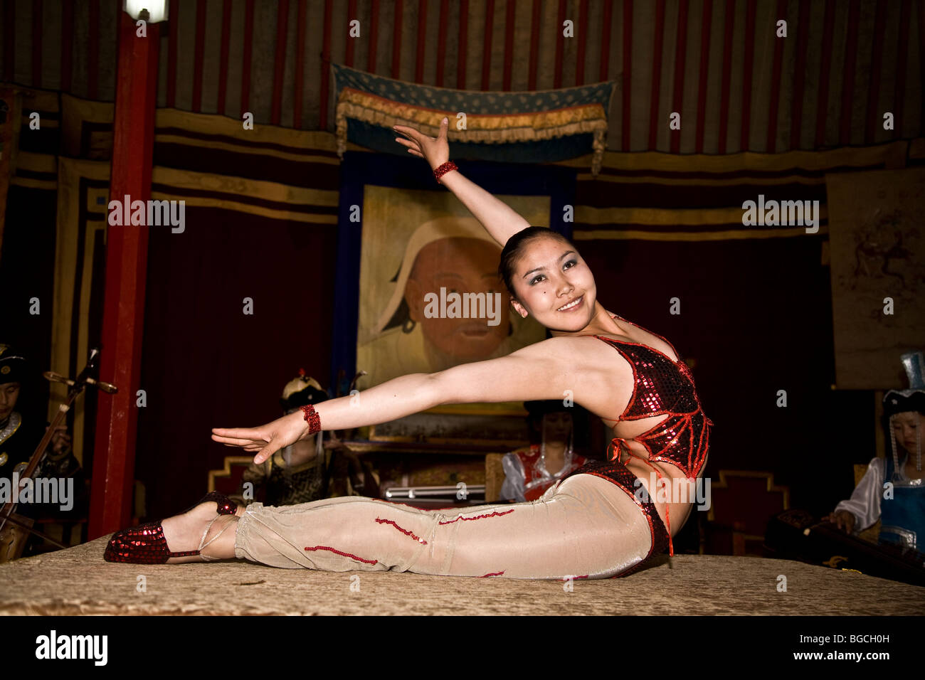 Female Mongolian acrobat in traditional costume Stock Photo - Alamy