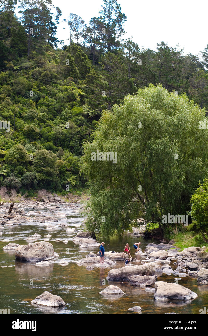 3 children and farther in the Karangahake Gorge on the Ohinemuri river, New Zealand Stock Photo