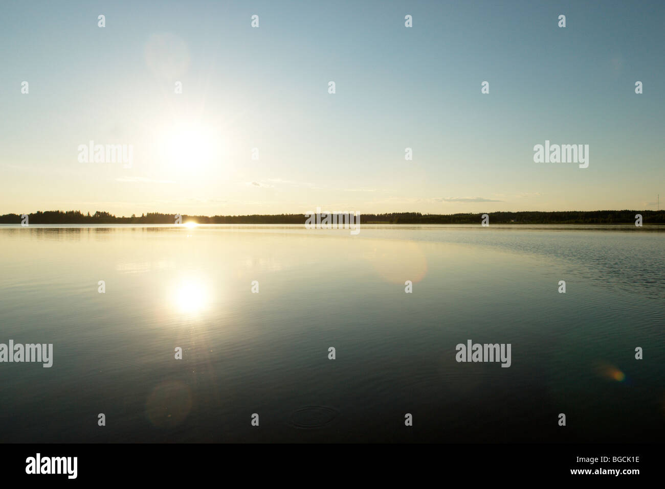 Warm summer evening by calm lake, Western Finland Stock Photo