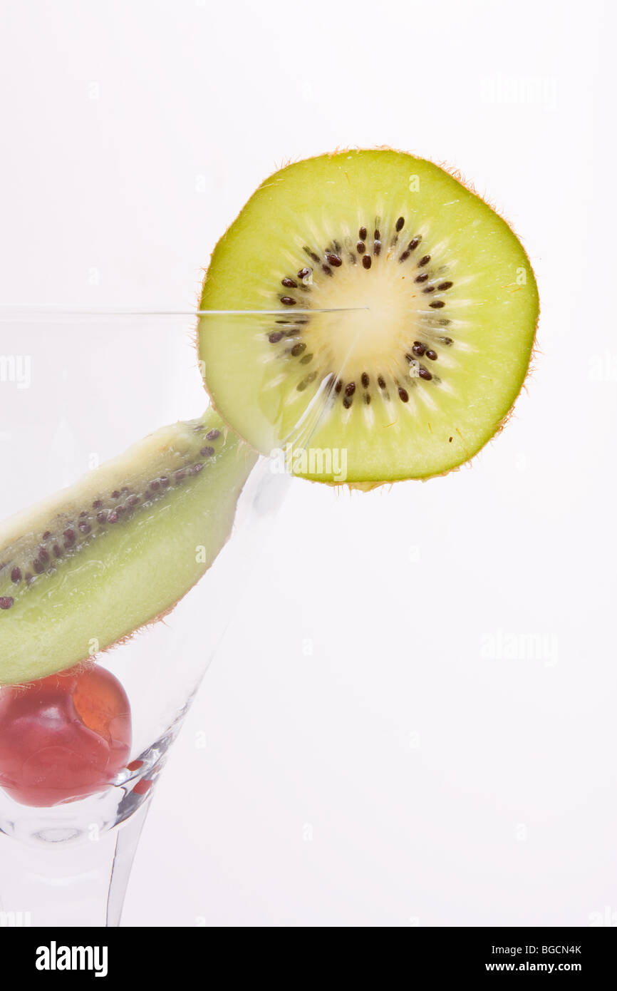 Mixed Fruit cocktail of kiwi, cherry and lemon juice isolated against white background. Stock Photo