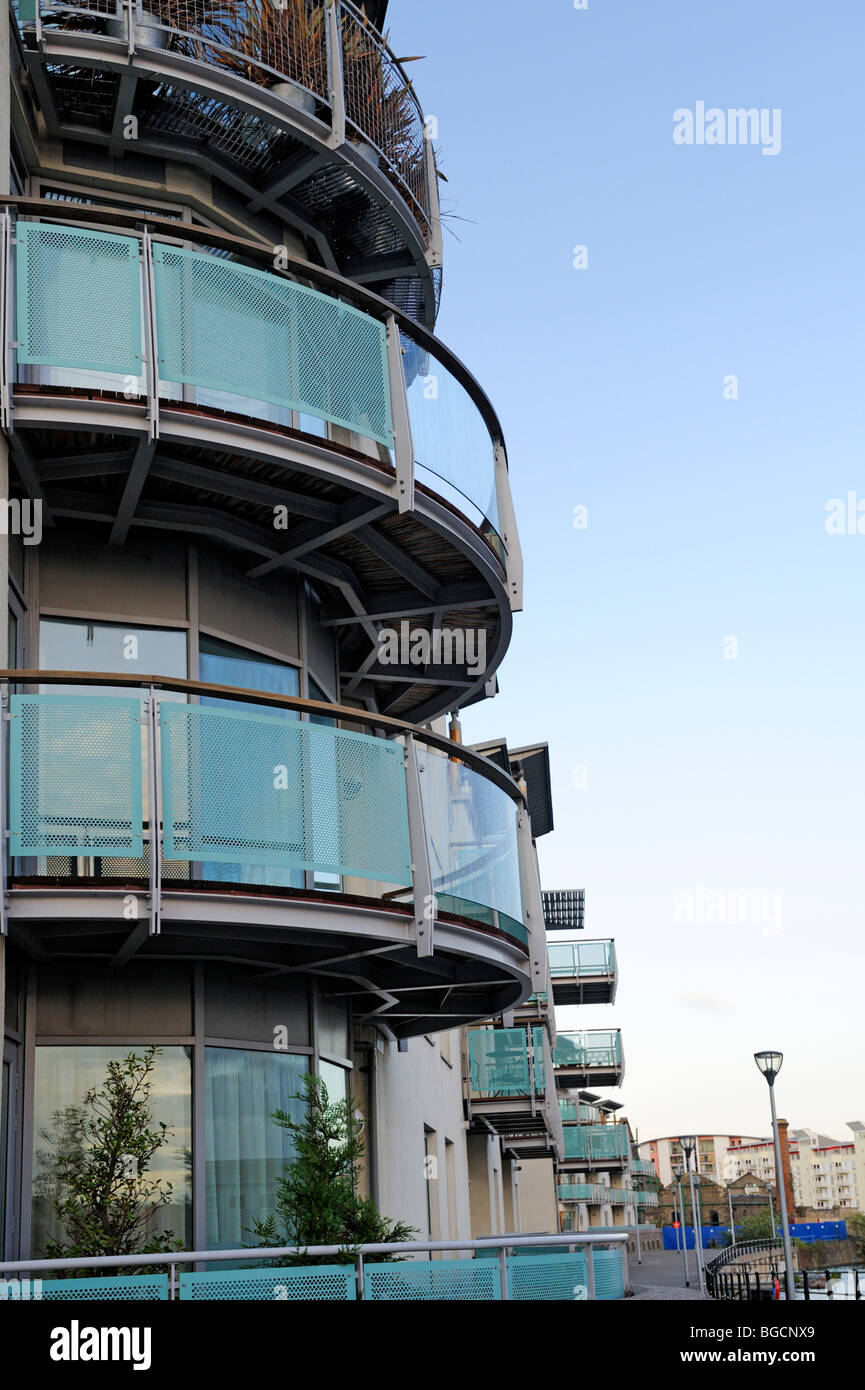 Modern block of flats with glass balconies, Bristol harbourside, UK