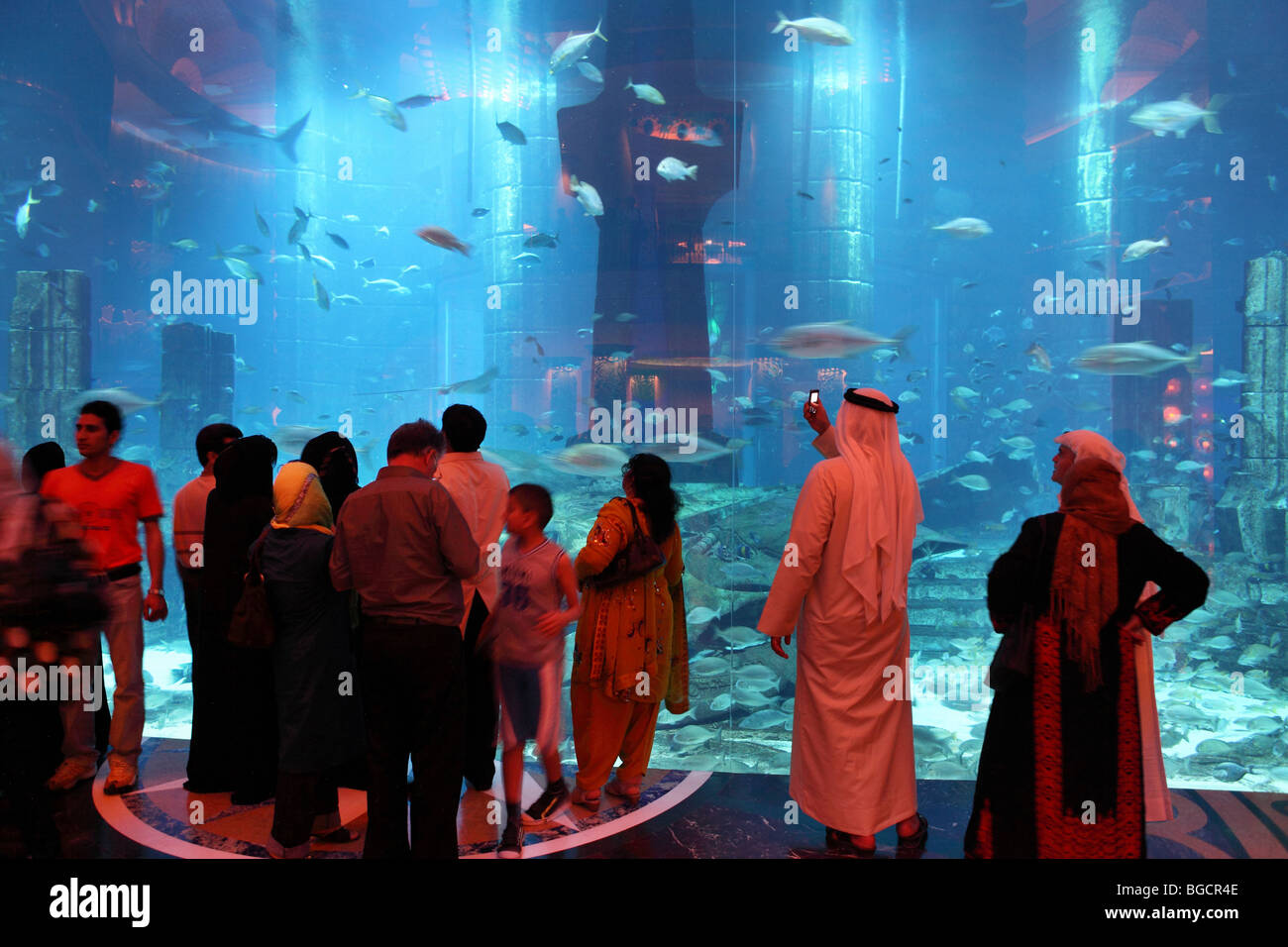 Hotel guests in front of the Ambassador Lagoon, Dubai, United Arab Emirates Stock Photo