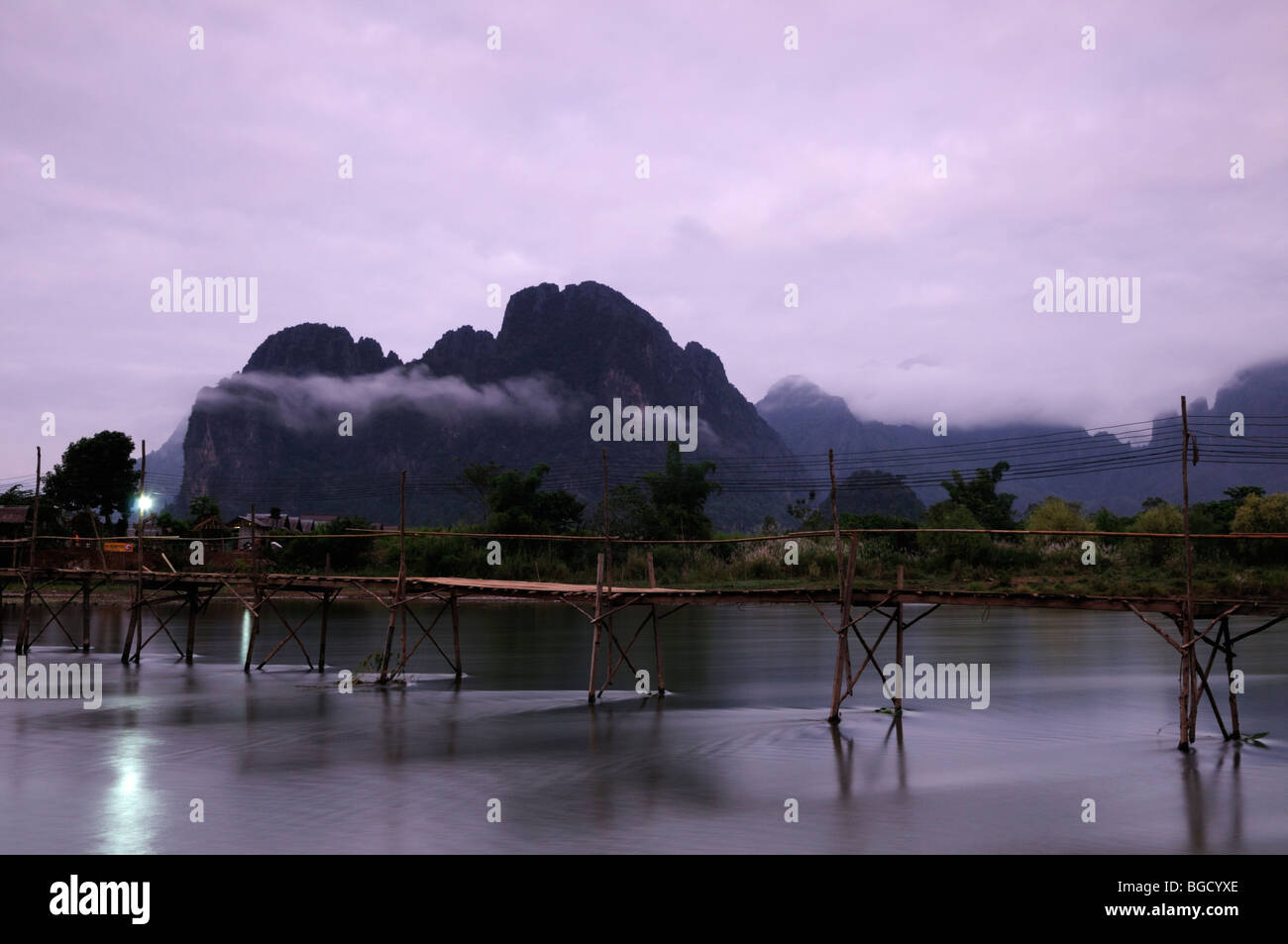 Laos; Vang Vieng; Bridge over the Nam Song River at Dawn Stock Photo