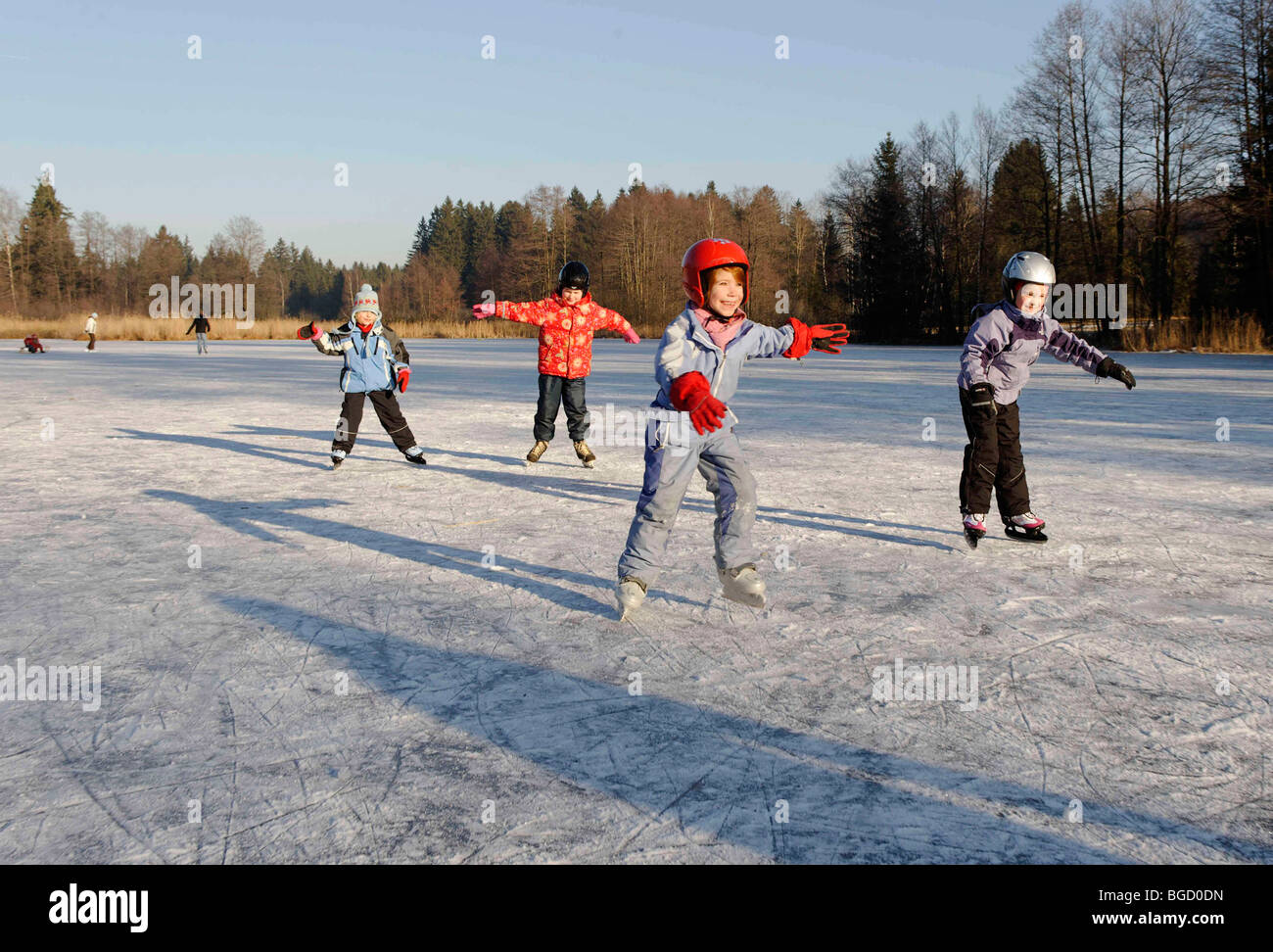 Children ice skating Stock Photo