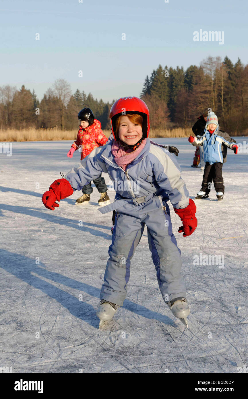 Children ice skating Stock Photo